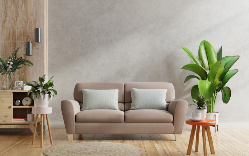 Brown sofa wooden table living room interior with plant concrete wall